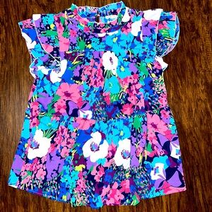 Very flowy, vibrant top.